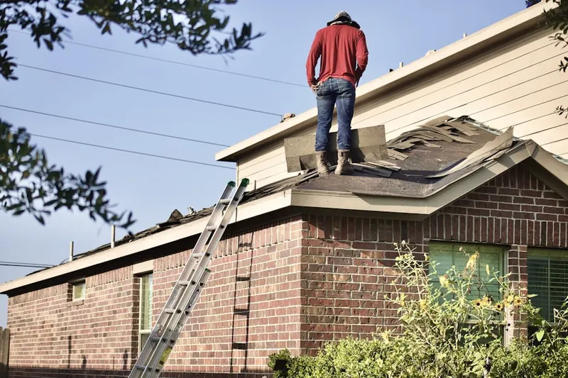 Professional roofer working on a residential roof in Marblehead Inland